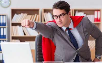 Image of a superhero office worker wearing a cape, thrusting his fist out to indicate that he has a win – perhaps he negotiated a volume discount after tracking his purchase orders in Dynamics 365 Business Central!